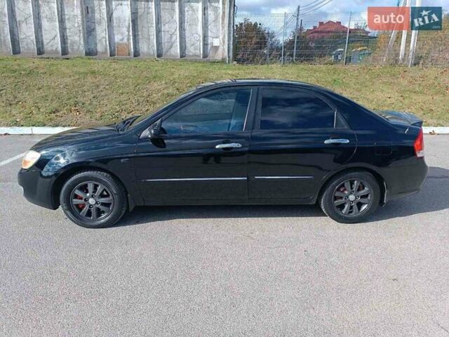 Черный Киа Черато, объемом двигателя 2 л и пробегом 298 тыс. км за 4250 $, фото 4 на Automoto.ua