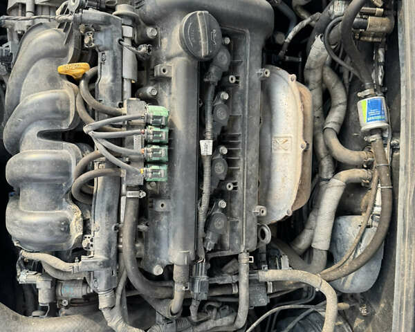 Чорний Кіа Черато, об'ємом двигуна 1.6 л та пробігом 156 тис. км за 4900 $, фото 12 на Automoto.ua