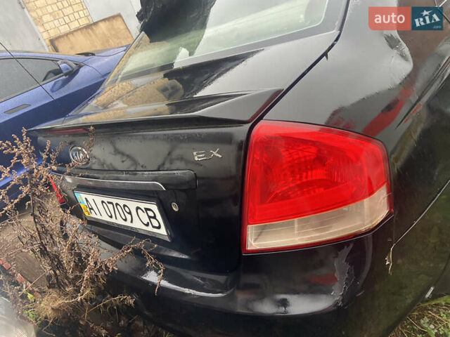 Черный Киа Черато, объемом двигателя 1.98 л и пробегом 95 тыс. км за 1650 $, фото 1 на Automoto.ua