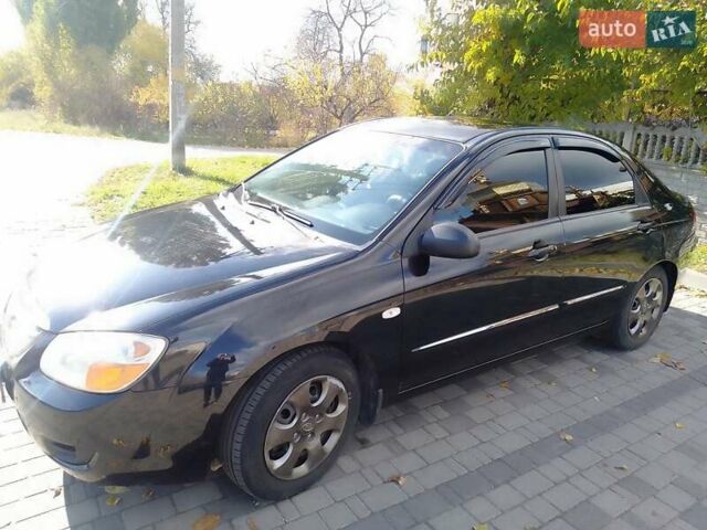 Чорний Кіа Черато, об'ємом двигуна 1.6 л та пробігом 335 тис. км за 5500 $, фото 10 на Automoto.ua