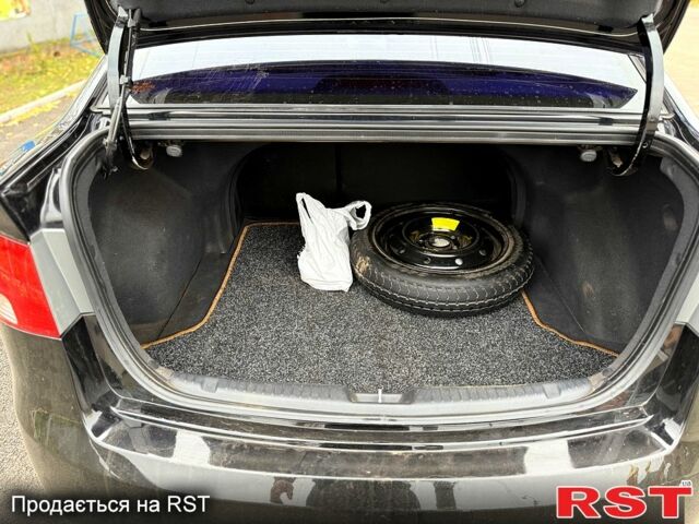 Черный Киа Черато, объемом двигателя 1.6 л и пробегом 200 тыс. км за 5650 $, фото 9 на Automoto.ua