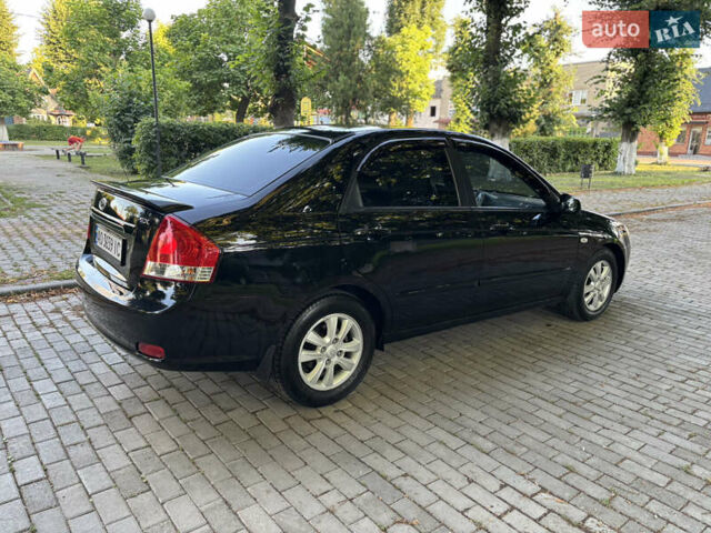 Черный Киа Черато, объемом двигателя 1.98 л и пробегом 264 тыс. км за 5700 $, фото 8 на Automoto.ua