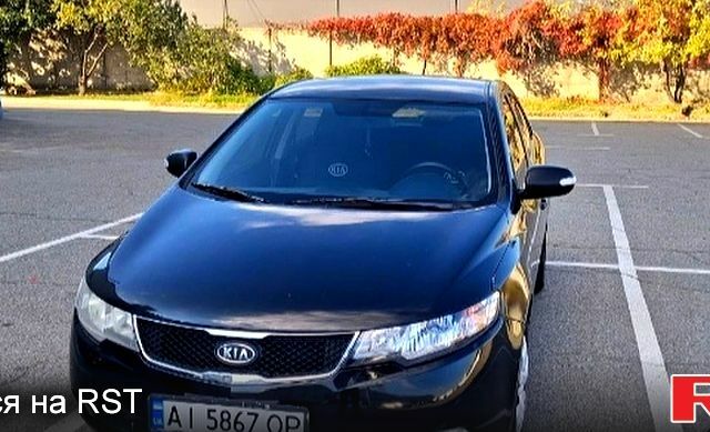 Черный Киа Черато, объемом двигателя 1.6 л и пробегом 300 тыс. км за 4999 $, фото 1 на Automoto.ua