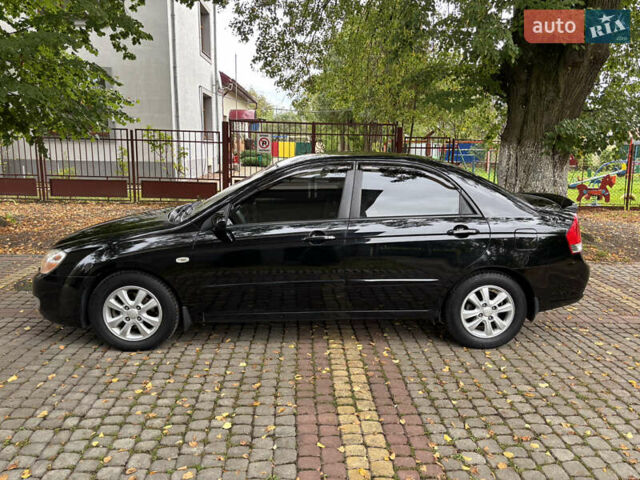 Черный Киа Черато, объемом двигателя 1.98 л и пробегом 264 тыс. км за 5800 $, фото 6 на Automoto.ua