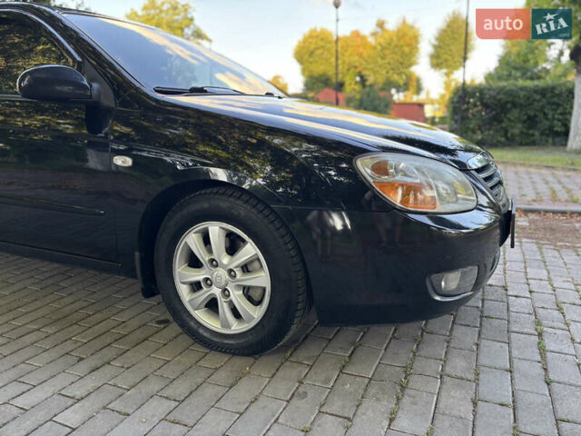 Черный Киа Черато, объемом двигателя 1.98 л и пробегом 264 тыс. км за 5700 $, фото 10 на Automoto.ua
