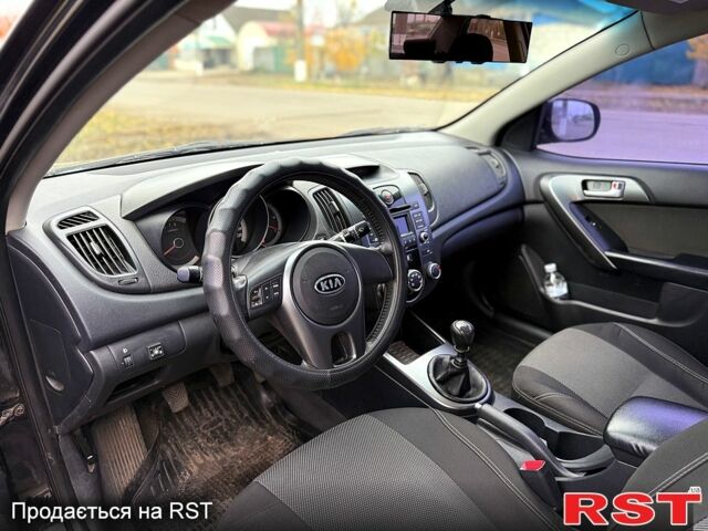 Черный Киа Черато, объемом двигателя 1.6 л и пробегом 200 тыс. км за 5650 $, фото 6 на Automoto.ua
