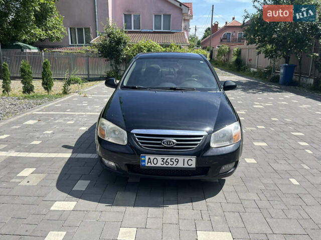 Чорний Кіа Черато, об'ємом двигуна 1.98 л та пробігом 263 тис. км за 4599 $, фото 1 на Automoto.ua