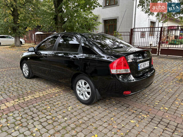 Черный Киа Черато, объемом двигателя 1.98 л и пробегом 264 тыс. км за 5800 $, фото 5 на Automoto.ua