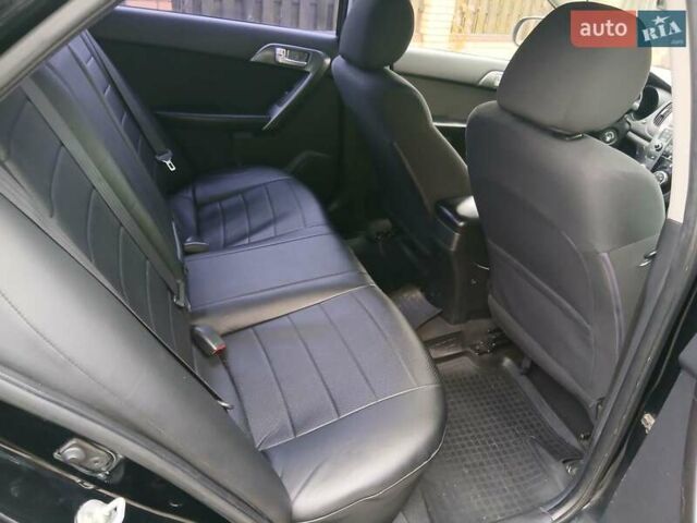 Черный Киа Черато, объемом двигателя 1.59 л и пробегом 253 тыс. км за 5300 $, фото 21 на Automoto.ua