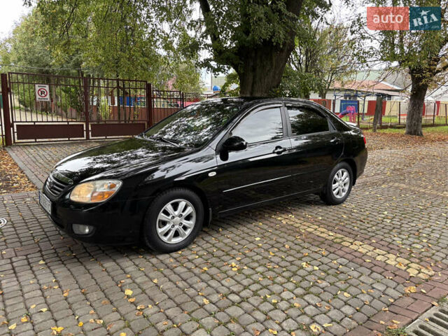 Черный Киа Черато, объемом двигателя 1.98 л и пробегом 264 тыс. км за 5800 $, фото 7 на Automoto.ua