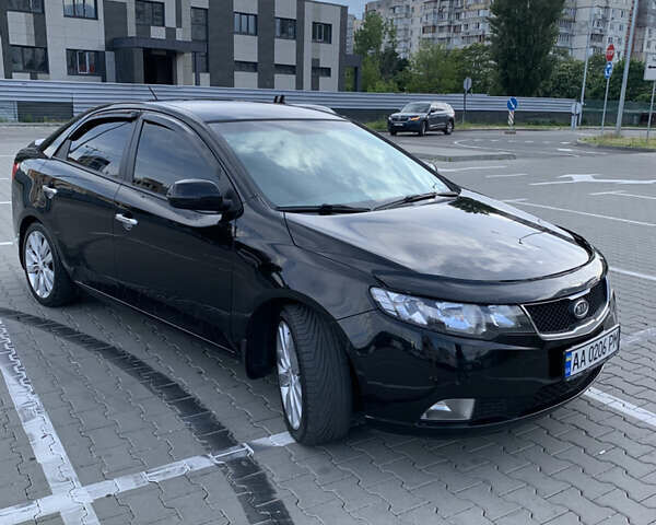 Черный Киа Черато, объемом двигателя 2 л и пробегом 175 тыс. км за 9400 $, фото 1 на Automoto.ua