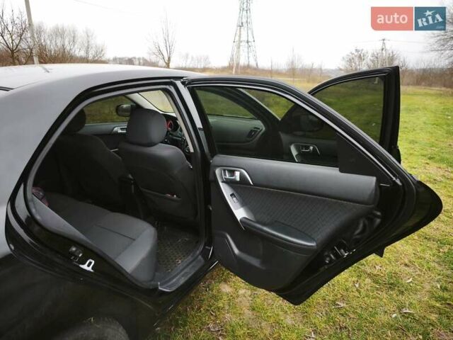 Черный Киа Черато, объемом двигателя 2 л и пробегом 96 тыс. км за 8500 $, фото 7 на Automoto.ua