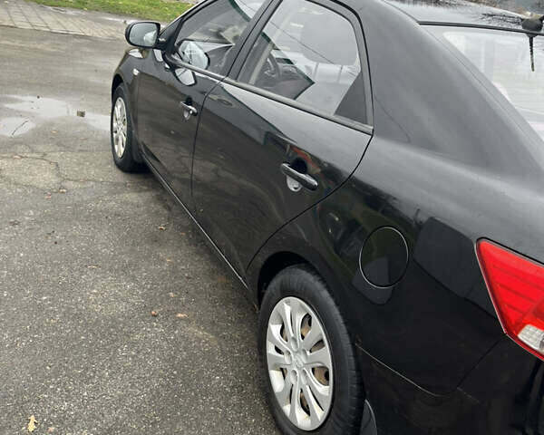 Чорний Кіа Черато, об'ємом двигуна 1.59 л та пробігом 170 тис. км за 7450 $, фото 4 на Automoto.ua