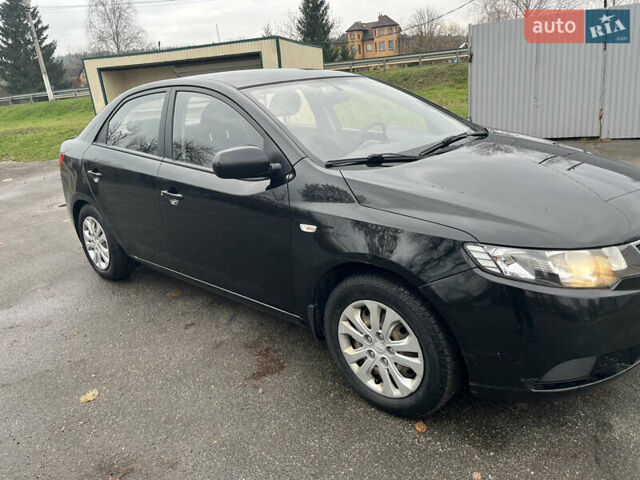 Чорний Кіа Черато, об'ємом двигуна 1.59 л та пробігом 170 тис. км за 7450 $, фото 2 на Automoto.ua