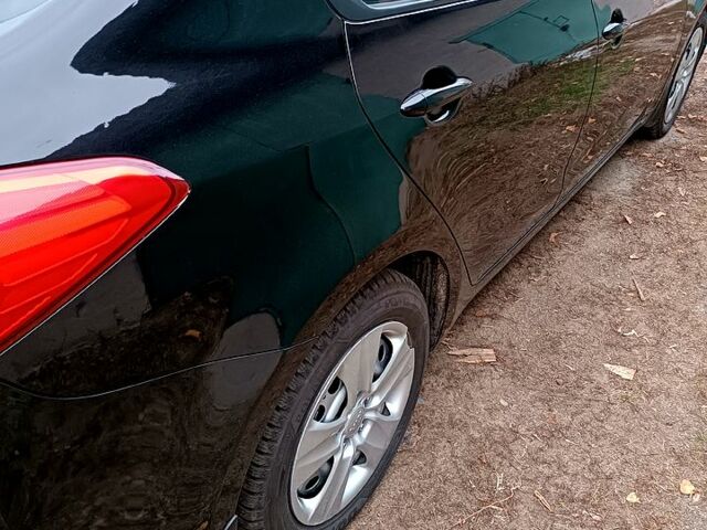 Чорний Кіа Черато, об'ємом двигуна 1.6 л та пробігом 140 тис. км за 8600 $, фото 1 на Automoto.ua