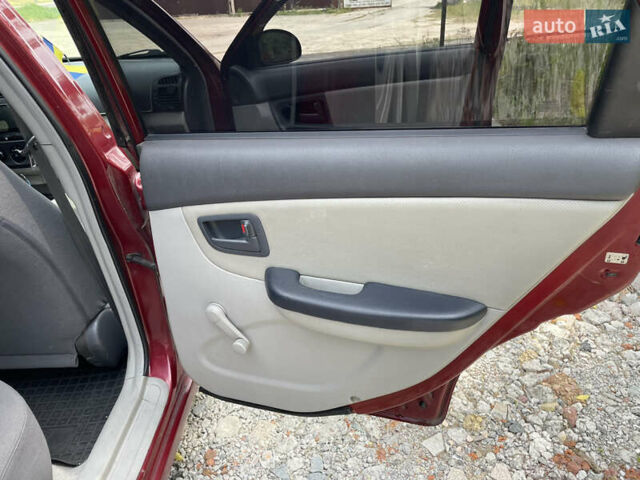 Червоний Кіа Черато, об'ємом двигуна 1.6 л та пробігом 340 тис. км за 2500 $, фото 12 на Automoto.ua