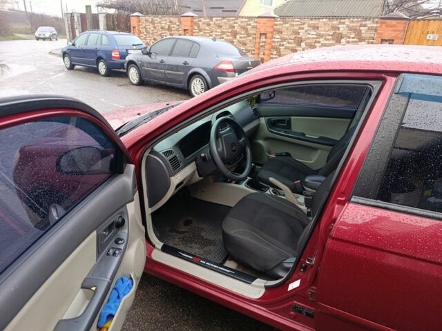 Красный Киа Черато, объемом двигателя 1.6 л и пробегом 230 тыс. км за 4400 $, фото 9 на Automoto.ua