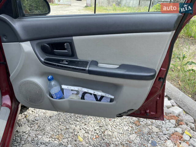 Червоний Кіа Черато, об'ємом двигуна 1.6 л та пробігом 340 тис. км за 2500 $, фото 16 на Automoto.ua