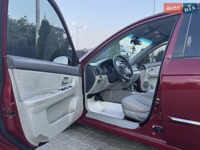 Красный Киа Черато, объемом двигателя 1.98 л и пробегом 180 тыс. км за 5600 $, фото 26 на Automoto.ua
