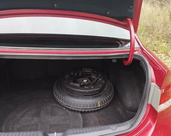 Червоний Кіа Черато, об'ємом двигуна 2 л та пробігом 345 тис. км за 6800 $, фото 7 на Automoto.ua