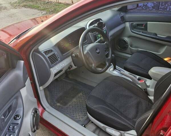 Красный Киа Черато, объемом двигателя 2 л и пробегом 233 тыс. км за 4700 $, фото 17 на Automoto.ua