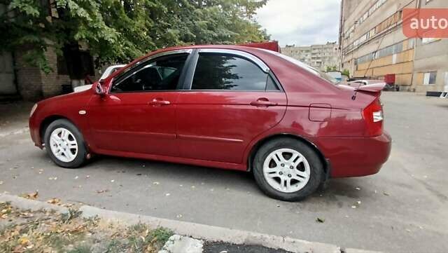 Красный Киа Черато, объемом двигателя 2 л и пробегом 140 тыс. км за 4500 $, фото 5 на Automoto.ua