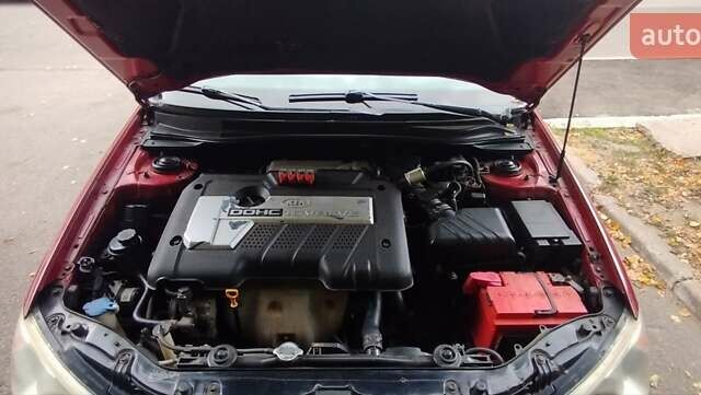Красный Киа Черато, объемом двигателя 2 л и пробегом 140 тыс. км за 4500 $, фото 2 на Automoto.ua