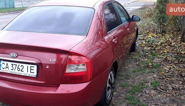 Красный Киа Черато, объемом двигателя 1.6 л и пробегом 229 тыс. км за 4500 $, фото 1 на Automoto.ua
