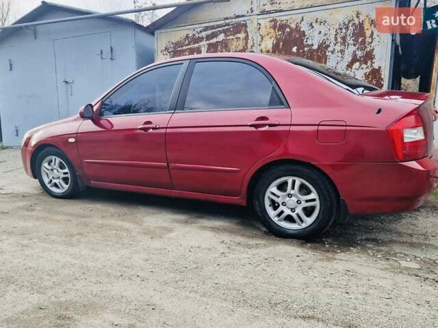 Красный Киа Черато, объемом двигателя 2 л и пробегом 233 тыс. км за 4700 $, фото 4 на Automoto.ua