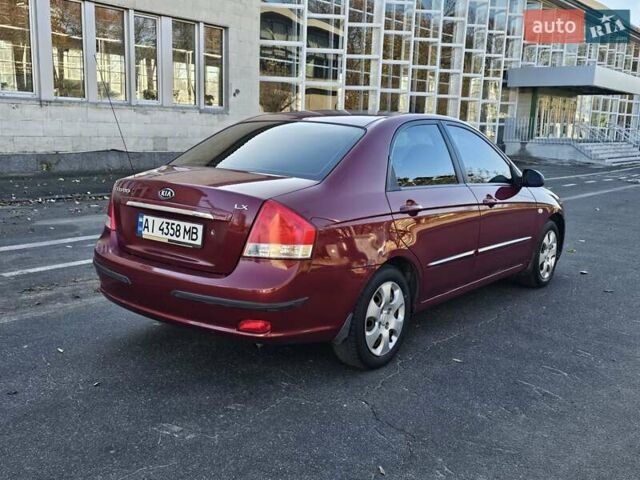 Красный Киа Черато, объемом двигателя 1.6 л и пробегом 200 тыс. км за 2600 $, фото 1 на Automoto.ua