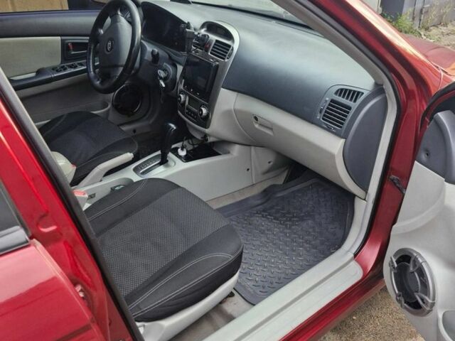 Красный Киа Черато, объемом двигателя 2 л и пробегом 233 тыс. км за 4700 $, фото 7 на Automoto.ua