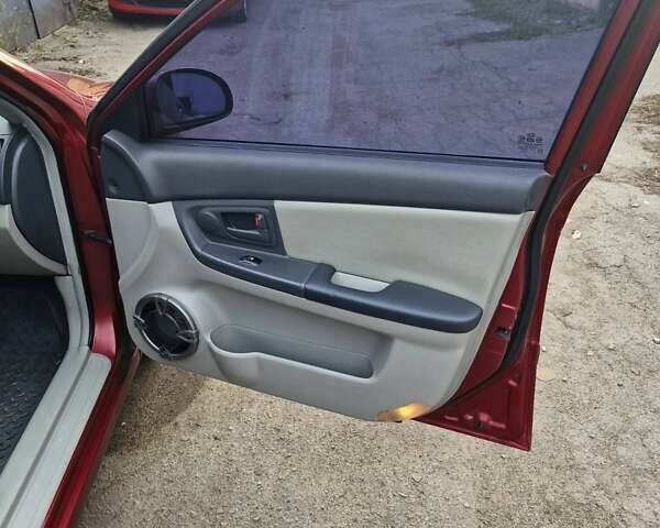 Красный Киа Черато, объемом двигателя 2 л и пробегом 233 тыс. км за 4700 $, фото 25 на Automoto.ua