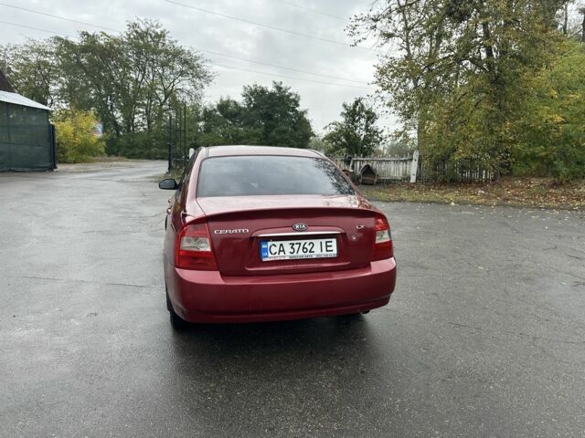 Красный Киа Черато, объемом двигателя 1.6 л и пробегом 228 тыс. км за 3850 $, фото 1 на Automoto.ua