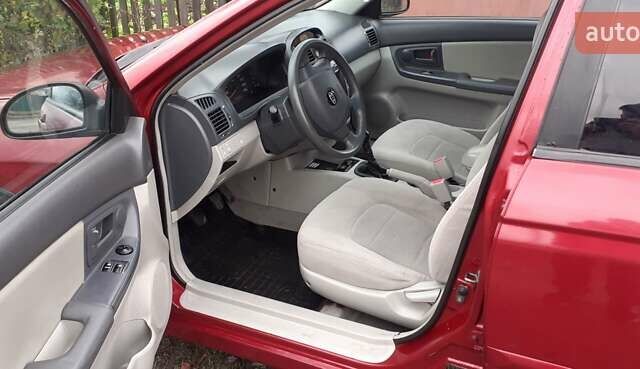 Красный Киа Черато, объемом двигателя 1.6 л и пробегом 229 тыс. км за 4500 $, фото 2 на Automoto.ua