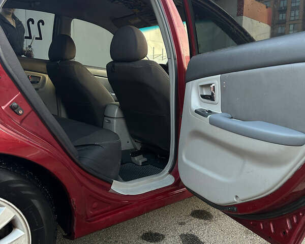 Красный Киа Черато, объемом двигателя 1.6 л и пробегом 212 тыс. км за 4500 $, фото 18 на Automoto.ua