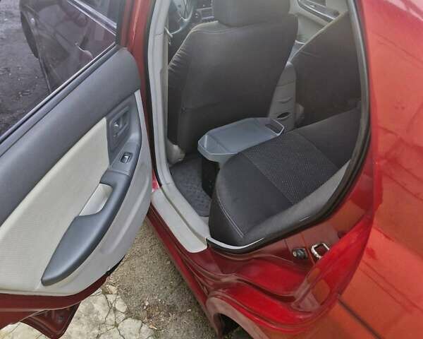 Красный Киа Черато, объемом двигателя 2 л и пробегом 233 тыс. км за 4700 $, фото 23 на Automoto.ua