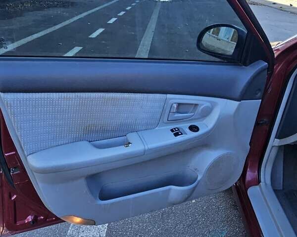 Красный Киа Черато, объемом двигателя 1.6 л и пробегом 200 тыс. км за 2600 $, фото 19 на Automoto.ua