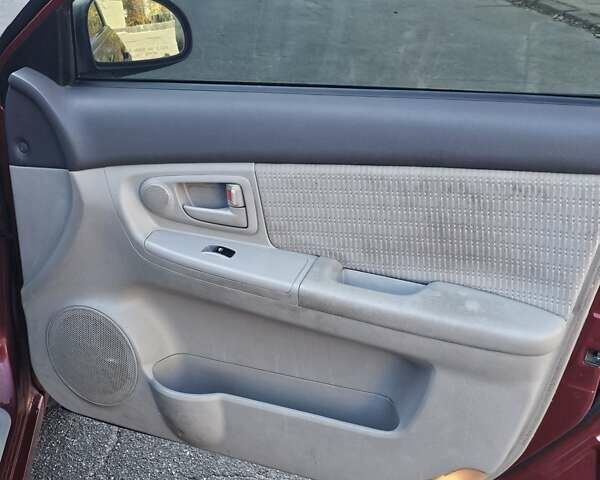 Красный Киа Черато, объемом двигателя 1.6 л и пробегом 200 тыс. км за 2600 $, фото 11 на Automoto.ua