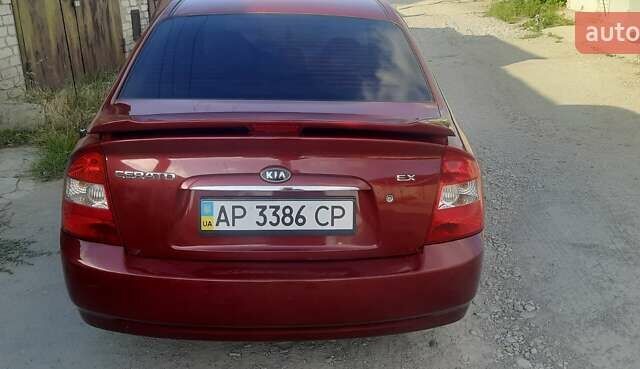 Красный Киа Черато, объемом двигателя 2 л и пробегом 144 тыс. км за 5400 $, фото 8 на Automoto.ua