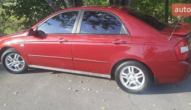 Красный Киа Черато, объемом двигателя 2 л и пробегом 144 тыс. км за 5400 $, фото 1 на Automoto.ua