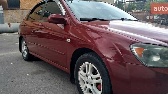 Красный Киа Черато, объемом двигателя 2 л и пробегом 140 тыс. км за 4500 $, фото 6 на Automoto.ua