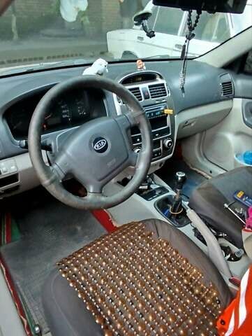 Красный Киа Черато, объемом двигателя 2 л и пробегом 140 тыс. км за 4500 $, фото 1 на Automoto.ua