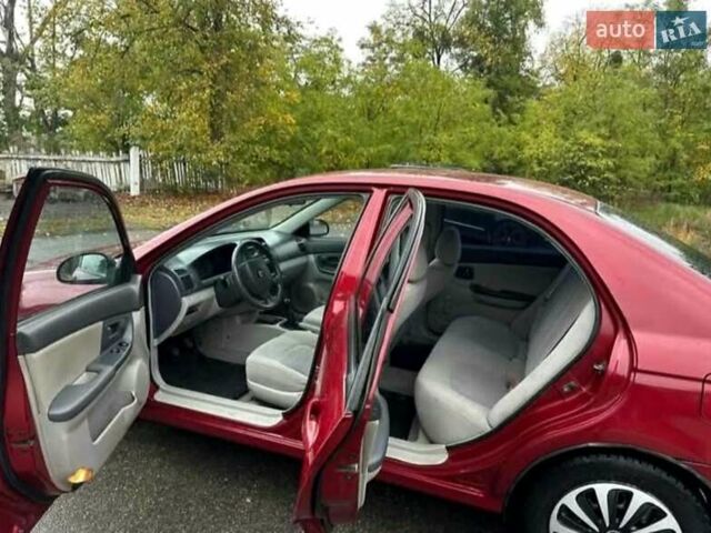 Красный Киа Черато, объемом двигателя 1.6 л и пробегом 229 тыс. км за 4500 $, фото 11 на Automoto.ua