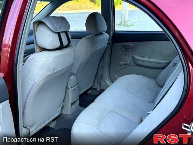 Красный Киа Черато, объемом двигателя 1.6 л и пробегом 250 тыс. км за 3500 $, фото 3 на Automoto.ua