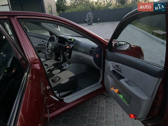 Красный Киа Черато, объемом двигателя 1.6 л и пробегом 198 тыс. км за 3750 $, фото 12 на Automoto.ua