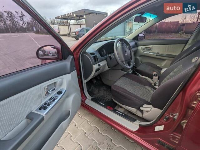 Красный Киа Черато, объемом двигателя 1.59 л и пробегом 240 тыс. км за 3750 $, фото 7 на Automoto.ua