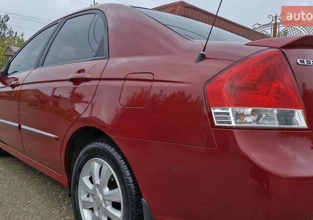 Красный Киа Черато, объемом двигателя 1.98 л и пробегом 120 тыс. км за 5650 $, фото 30 на Automoto.ua