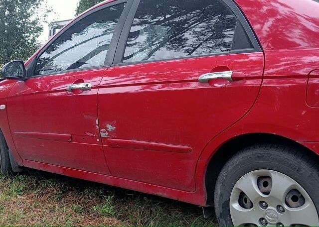 Красный Киа Черато, объемом двигателя 1.6 л и пробегом 250 тыс. км за 1200 $, фото 1 на Automoto.ua