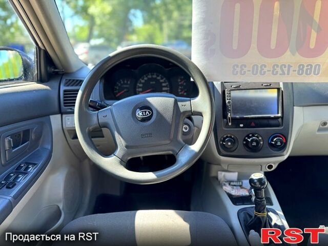 Сірий Кіа Черато, об'ємом двигуна 2 л та пробігом 295 тис. км за 3500 $, фото 6 на Automoto.ua