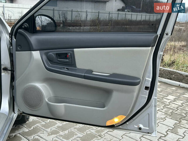 Серый Киа Черато, объемом двигателя 1.6 л и пробегом 177 тыс. км за 4000 $, фото 13 на Automoto.ua